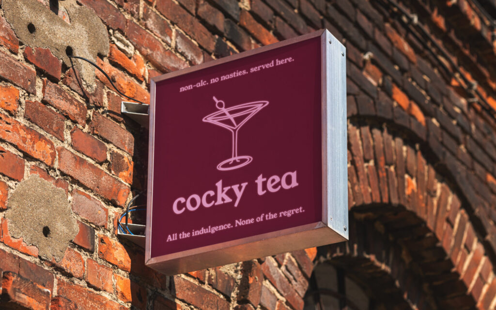 cocky tea wayfinding on brick exterior